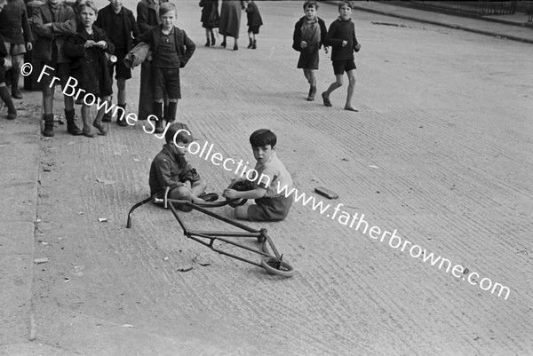 SLUMS CHILDREN WITH SCOOTER